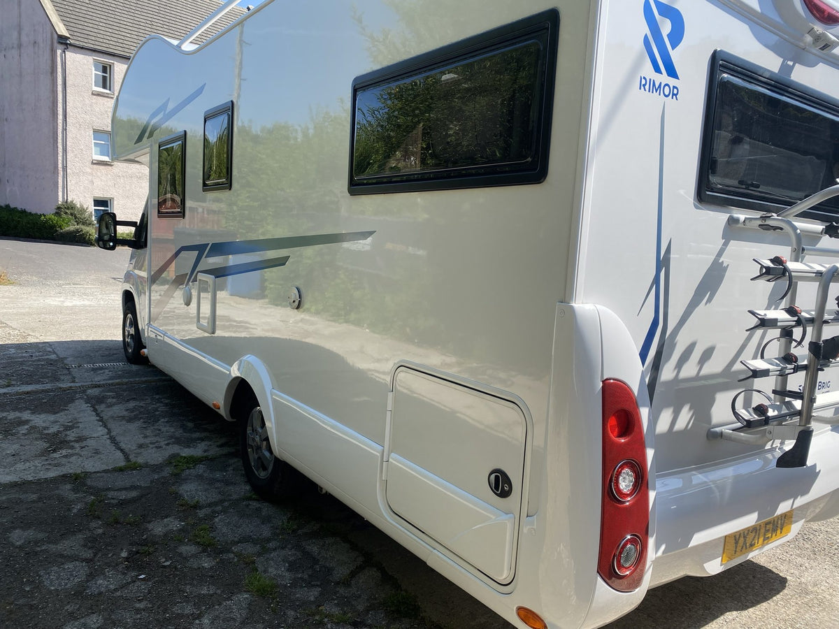 The side and rear of The Braw, showing the habitation windows, bike rack and Rimor badge
